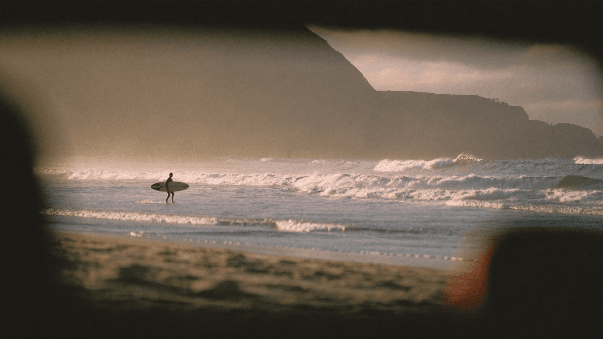 Early morning Atlantic surf beach near Taghazout Morocco with soft dawn light and gentle waves