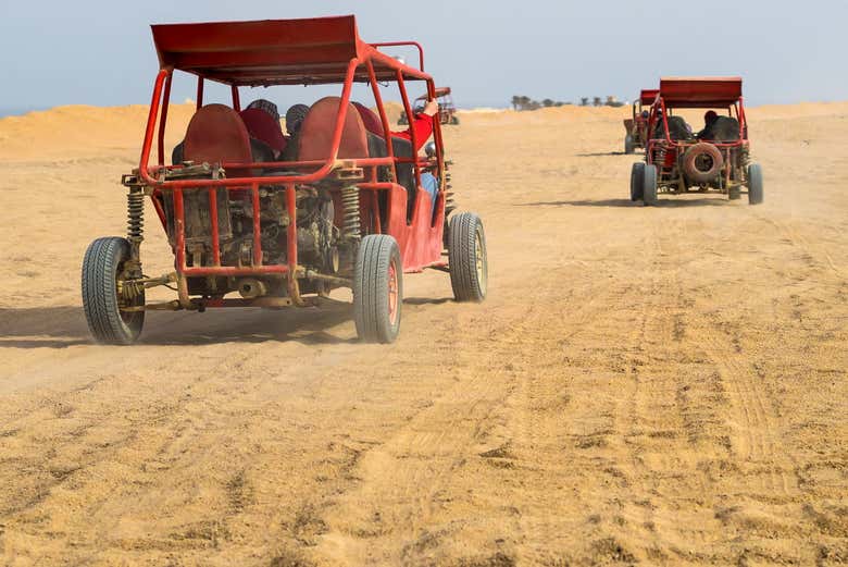 Dune buggy driving through the desert near Agadir on a guided buggy tour.