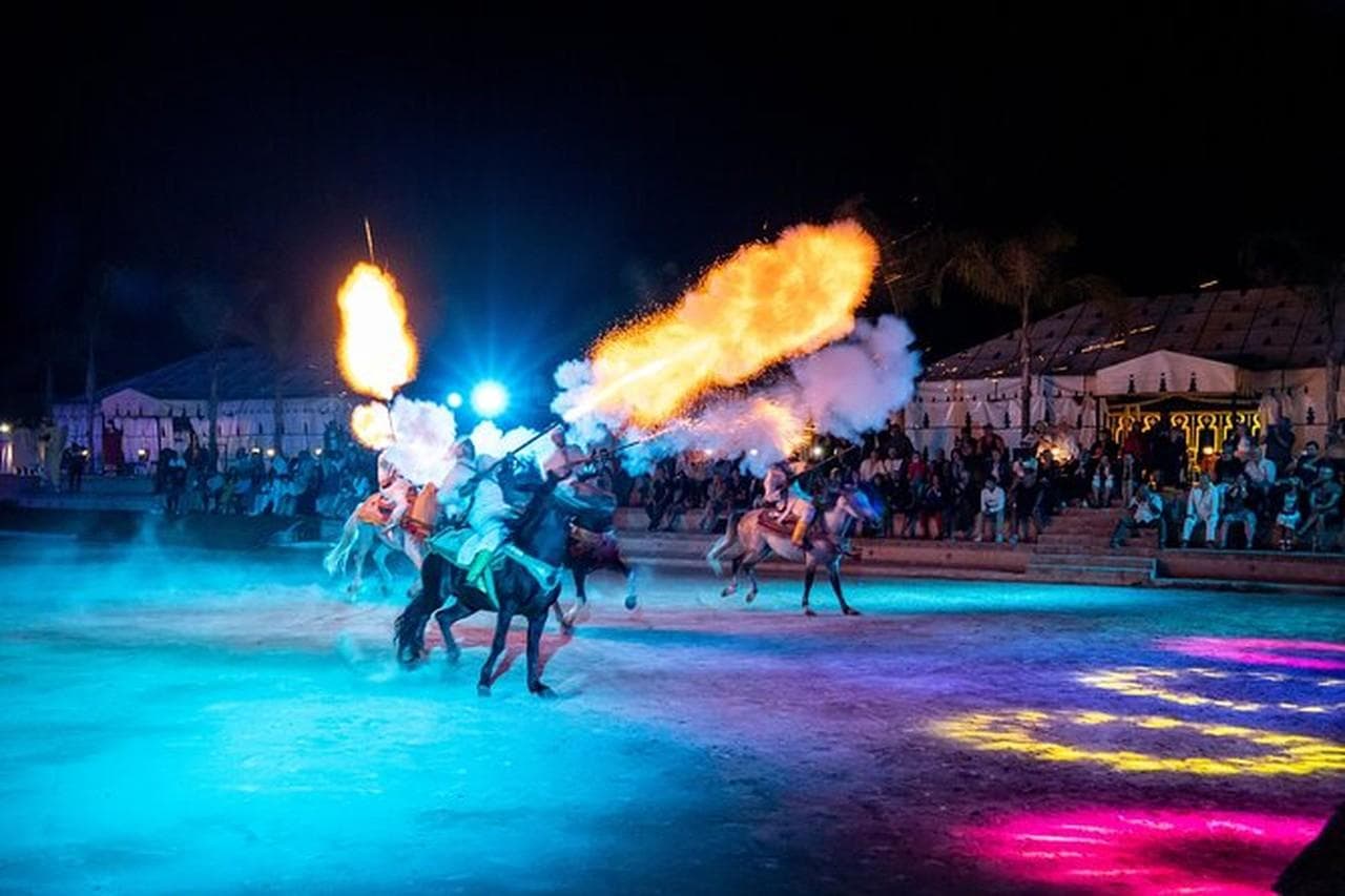 Fantasia horsemen firing flames in the Chems Ayour arena near Agadir.